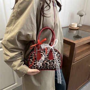 Retro leopard print boston bag with red leather trim and lace bow detail for women