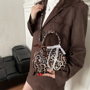Trendy leopard print crossbody bag with cherry charm and lace bow accessories