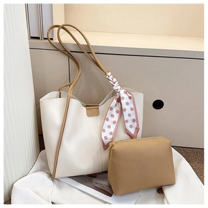 Detail of white tote bag with silk scarf, brown leather trim and inner pouch