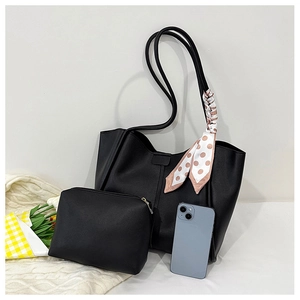 Close-up of black tote bag set with matching zipper pouch and decorative silk scarf