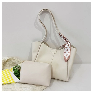 Detail of off-white tote bag set with matching zipper pouch and polka dot silk scarf decoration