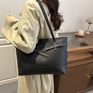 Large black lychee-textured tote bag for women, stylish commuting shoulder bag in use