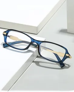 Modern rectangular blue resin computer safety glasses with gold metal accents on display