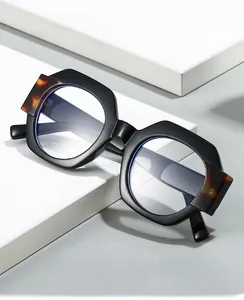 Detailed side view of geometric polygon glasses with tortoise pattern temple accents