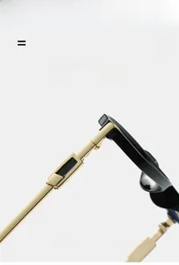 Detail of square glasses arm showing gold metal hinge and flexible black acetate temple