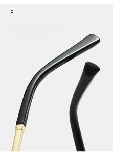 Detail of curved sunglasses legs with gold metal accents for comfortable ergonomic wear