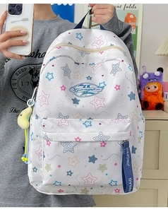 Detail of waterproof star pattern backpack with plush star charm and decorative strap