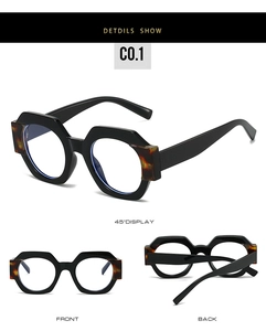 Detail view of stylish polygonal black glasses with tortoiseshell accents on the temples