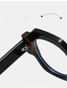 Detail view of durable metal hinges on polygon glasses with tortoise pattern inside