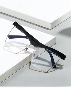 Detail of 2025 cat-eye half-frame glasses with black top and gold metal rim for blue light protection