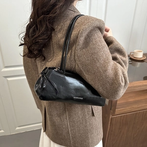 Chic black glossy patent leather shoulder bag with white fashion lettering for women