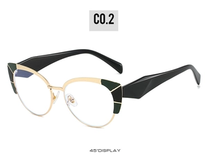 Detail view of cat-eye frames with gold metal finish and green accents at a 45-degree angle