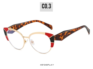 Golden cat-eye blue light blocking glasses with tortoiseshell temples and red accent detail