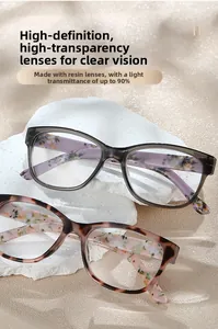 Detailed close-up of marble pattern reading glasses with premium resin lenses on stone