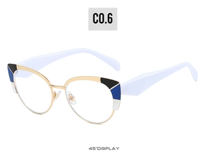 Detail view of cat eye glasses frame with gold metal and tricolor geometric corner accents