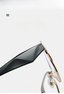 Detailed view of durable golden metal hinge and textured wave design temples on cat-eye glasses