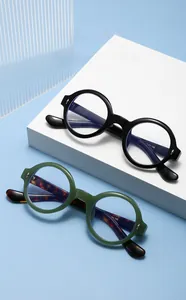 Detailed close-up of retro round frame sunglasses with 145mm temple length specs