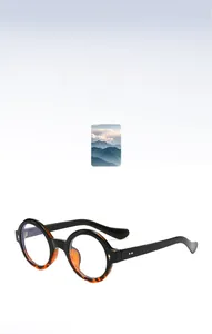 Macro detail of retro round glasses frame with black and tortoise shell splicing and rivets