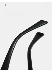 Detail of curved ergonomic temple on sleek black cat-eye glasses for a comfortable fit