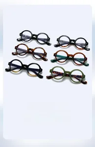 Flat lay of retro round frame sunglasses in various tortoise and solid color combinations