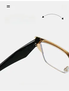 Macro view of durable golden metal reinforced hinges on stylish browline glasses