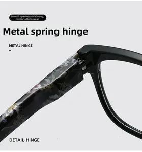 Detail view of durable metal spring hinges on marble pattern reading glasses