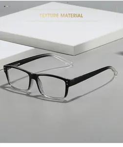 Détail de lunettes carrées dégradées noir et blanc avec rivets métalliques