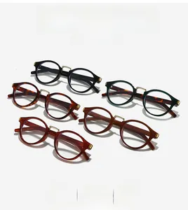 Detailed close-up showing five retro oval sunglasses frames in various colors with metal bridge