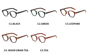 Detailed flat lay of oval retro sunglasses in multiple colors with gold metal accents