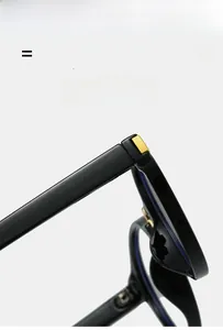 Detail of lightweight flexible black frame sunglasses with gold hinge metal decoration