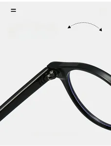Close-up of durable metal hinge on black oval sunglasses showing precise construction