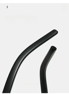 Detail view of ergonomic curved black temple legs on oval vintage sunglasses