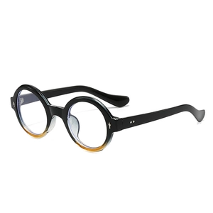 Retro round frame sunglasses with black and amber gradient finish and silver dot accents
