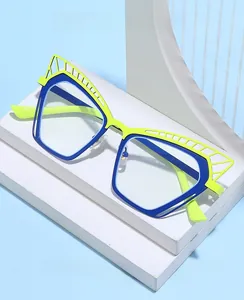 Macro detail of cat-eye geometric eyeglass frames with fluorescent green and blue contrast