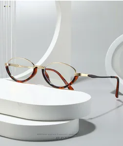 Detail of cat-eye frames with gold and tortoiseshell finish on geometric display