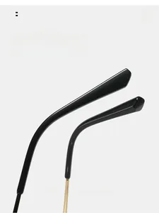 Detail of curved black and gold temple tips for comfortable ergonomic sunglasses wear