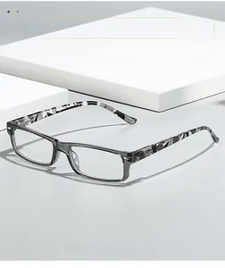Detail of trendy transparent gray rectangular glasses frames with camouflage pattern temples