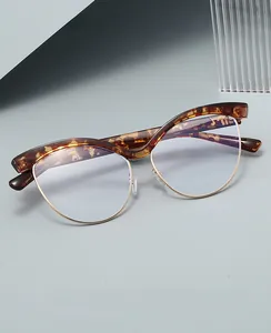 Detail of tortoiseshell and gold metal half-frame cat eye blue light blocking glasses