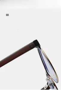 Macro view of gold metal frames with tortoiseshell acetate temples on cat-eye glasses