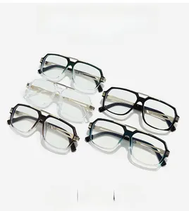 Detail of colorful trendy thick frame glasses showing metal hinges and gold accents