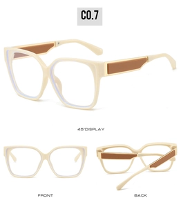 Vue triple des lunettes oeil-de-chat crème avec accents bruns et garniture dorée