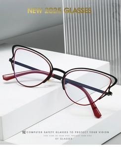 Detail of stylish cat-eye computer glasses featuring a dual-tone red and black frame