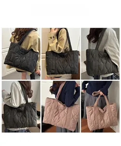 Quilted puffer tote bag showing large capacity and soft nylon texture in multiple colors