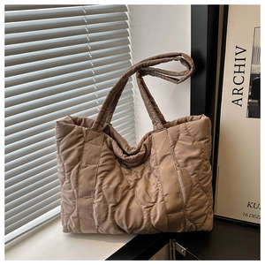 Stylish khaki quilted tote bag with wave stitching for women, perfect for daily commuting