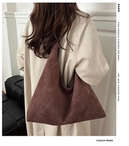 Brown matte suede tote bag shown on model for a trendy oversized slouchy hobo look