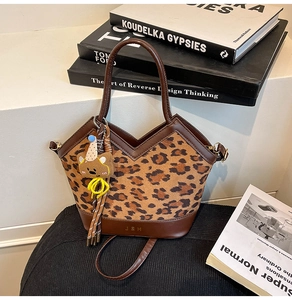 Leopard print handbag with leather patchwork and cute bear charm on books
