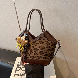 Leopard print crossbody handbag with brown leather trim and cute bear charm detail
