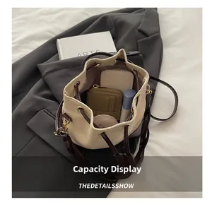 Detail view of the drawstring bucket bag interior showing spacious capacity for essentials
