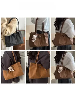 Collage of large matte tote bags in black, dark coffee and khaki with plush cat charms