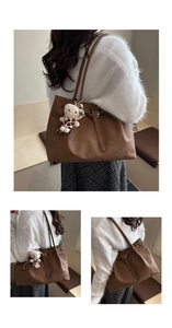 Detail of vintage brown tote bag with pleated leather texture and a plush bear pendant